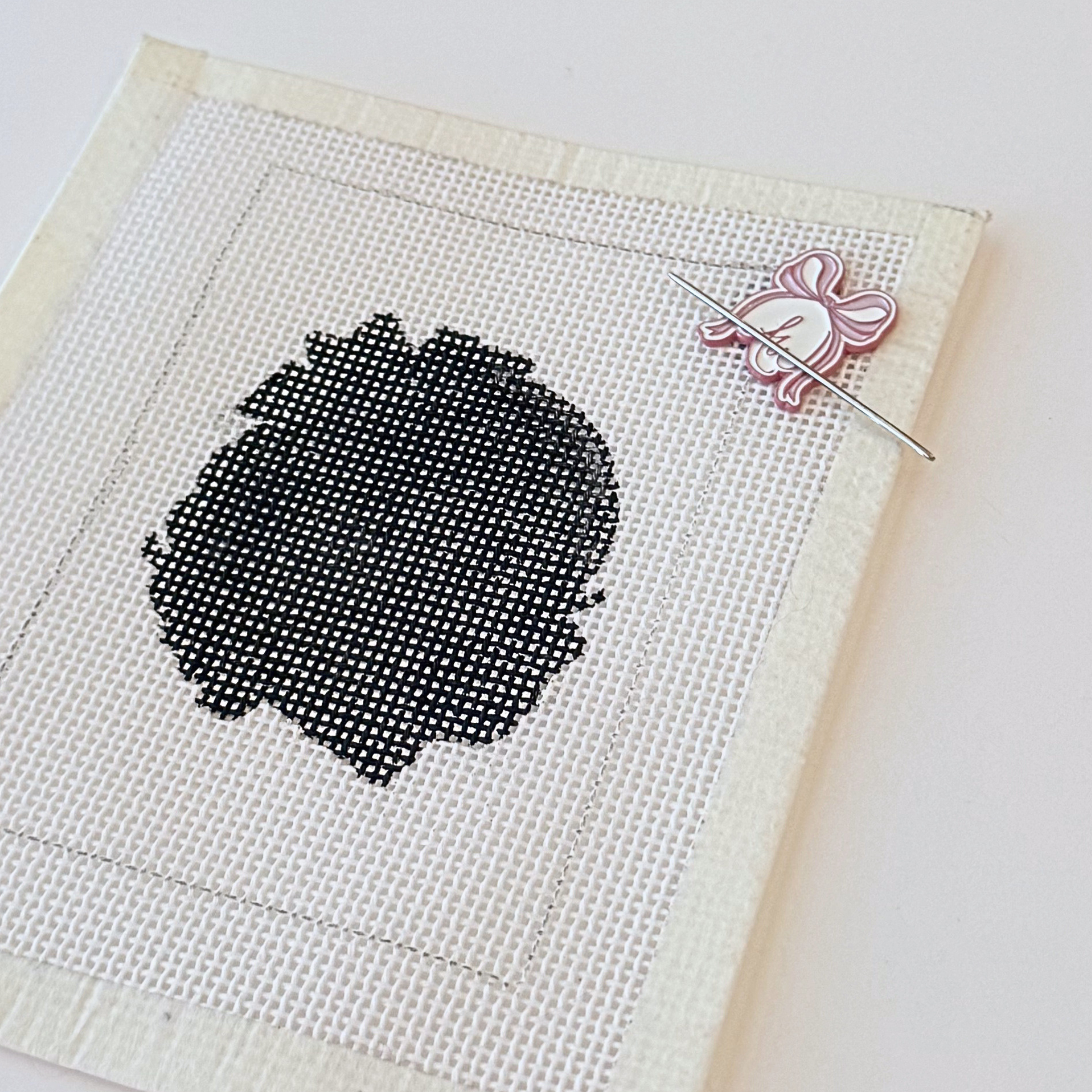 Bow needle minder for needlepoint with AW Needlework signature design