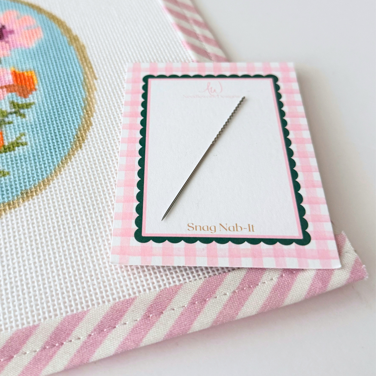 Needlepoint canvas after loose thread is pulled to the back with Snag Nab-It
