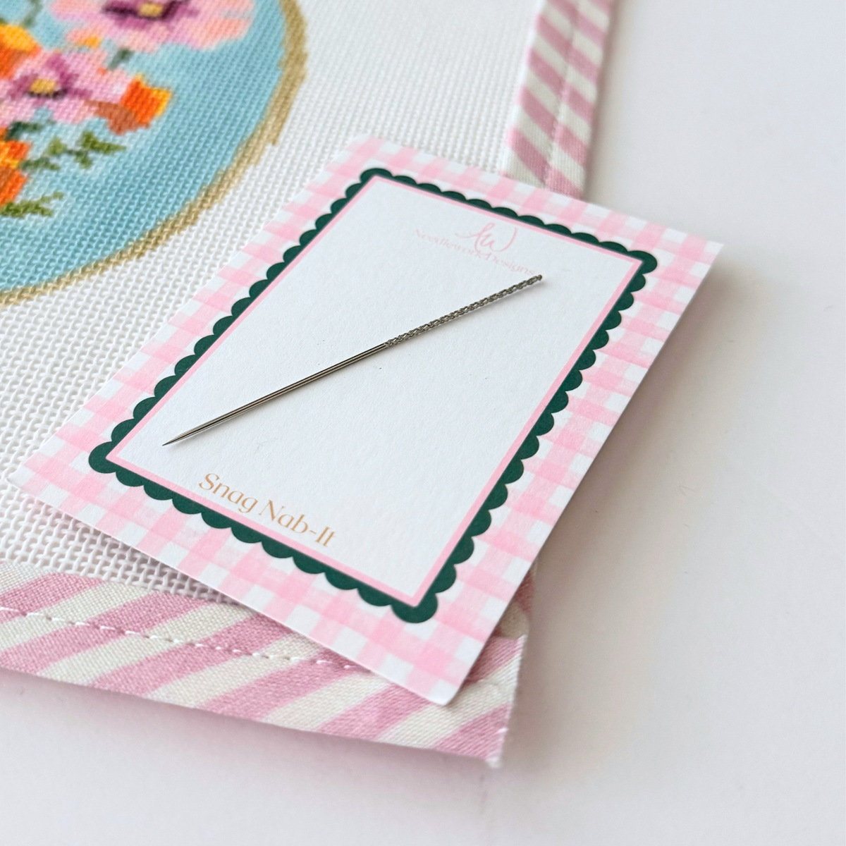 Dritz Snag Nab-It needlepoint tool for pulling loose threads to the back of canvas