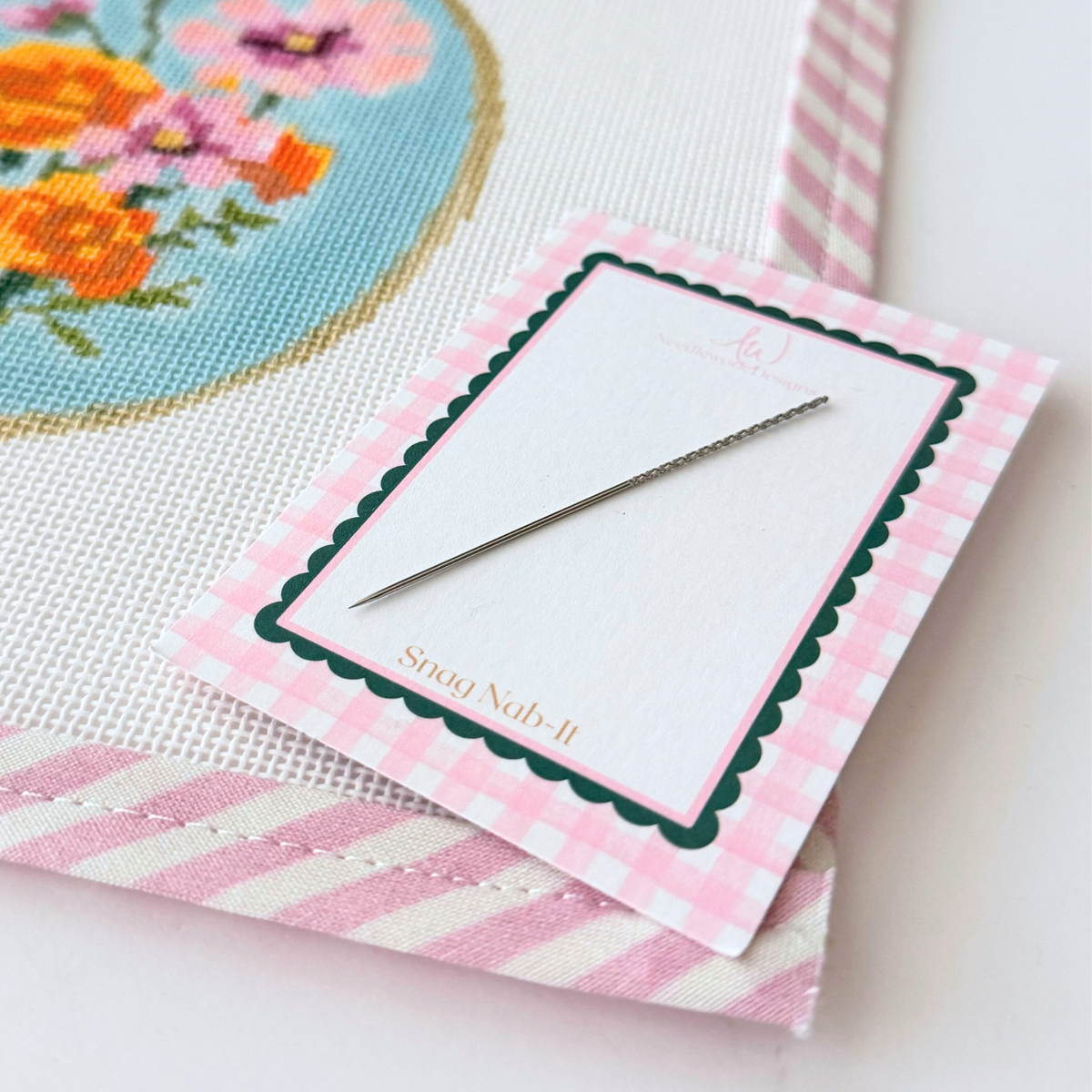 Snag Nab-It textured tool used to pull a stray needlepoint thread through canvas