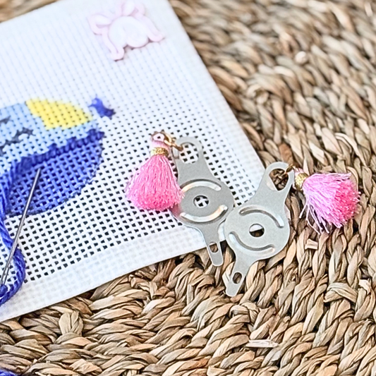 Needle threader with pink tassel for needlepoint project bags