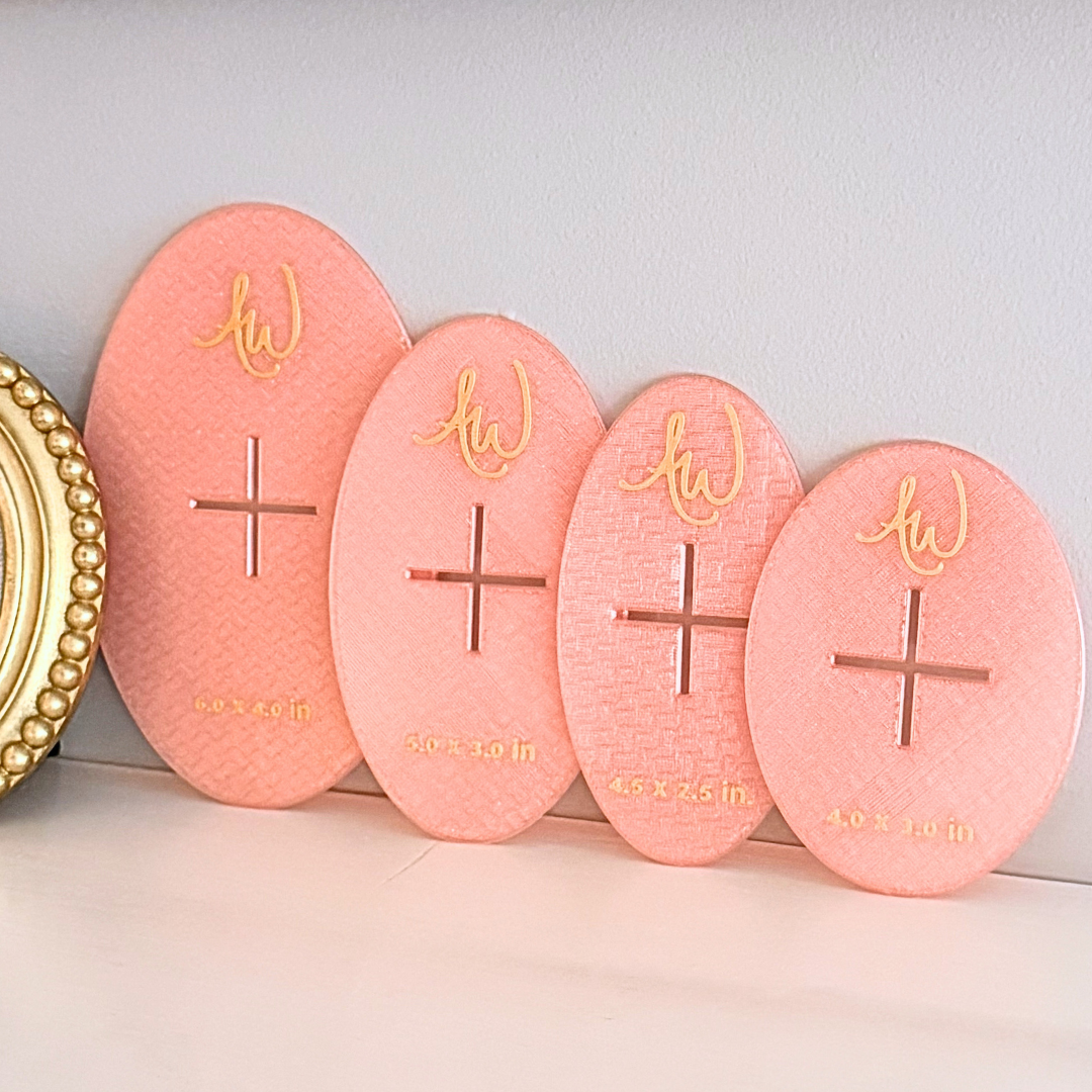 Oval needlepoint stencil set pictured on a mantle.