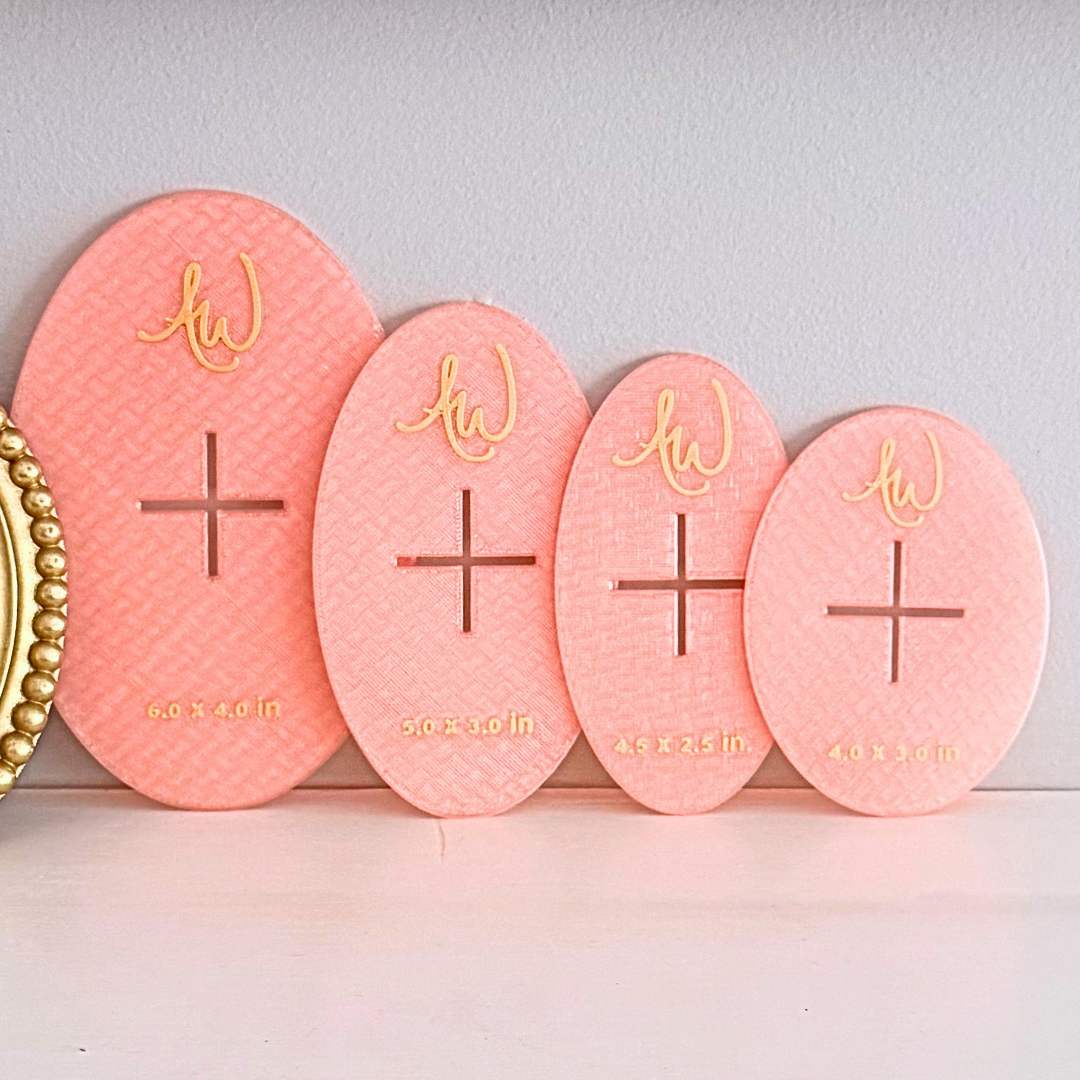 Oval needlepoint stencil set pictured on a mantle.