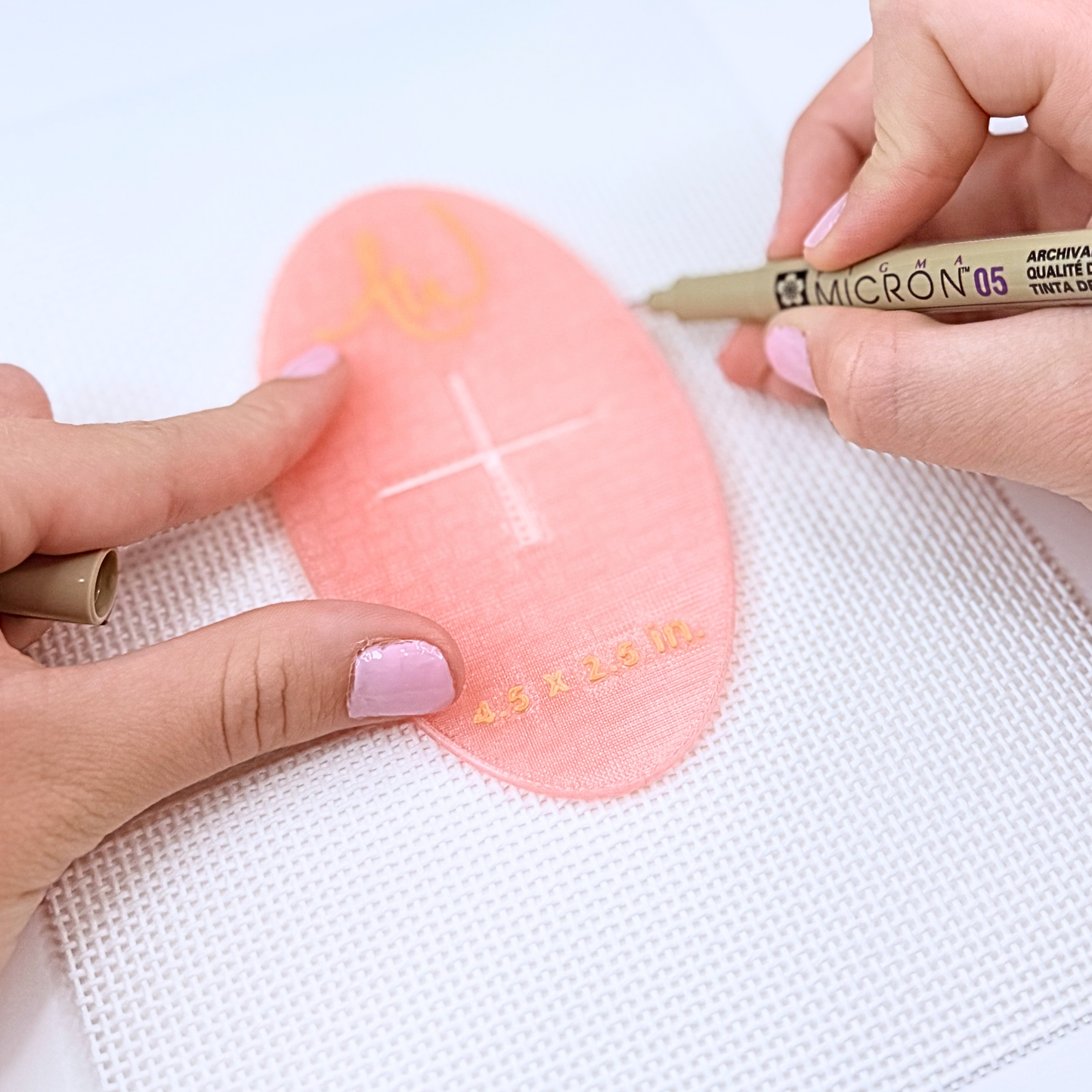 A photo on how to use the oval needlepoint stencil set.