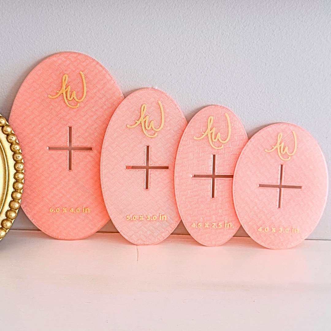 Oval needlepoint stencil set pictured on a mantle.