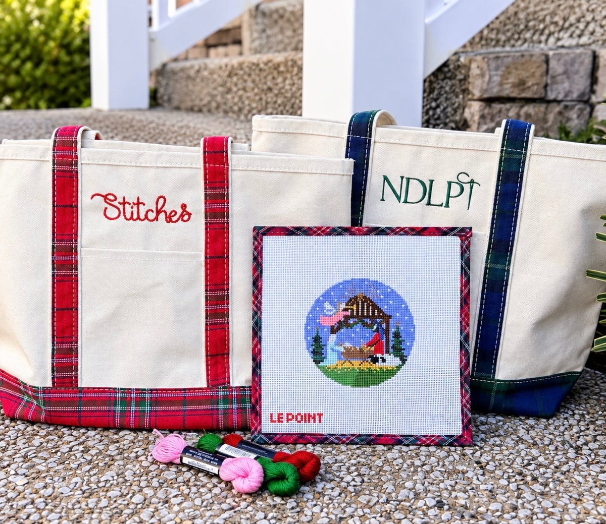 Medium needlepoint project tote showing red plaid and blue plaid