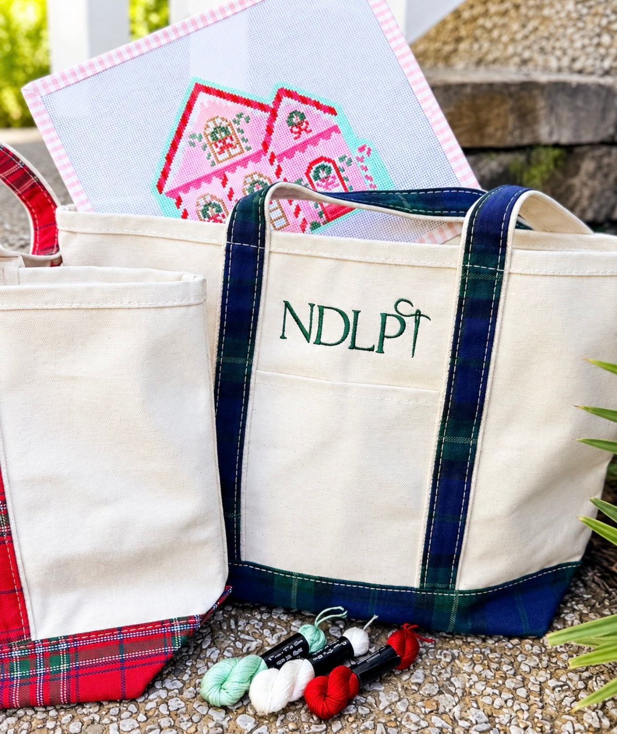 Front exterior pocket on heavyweight canvas needlepoint tote bag
